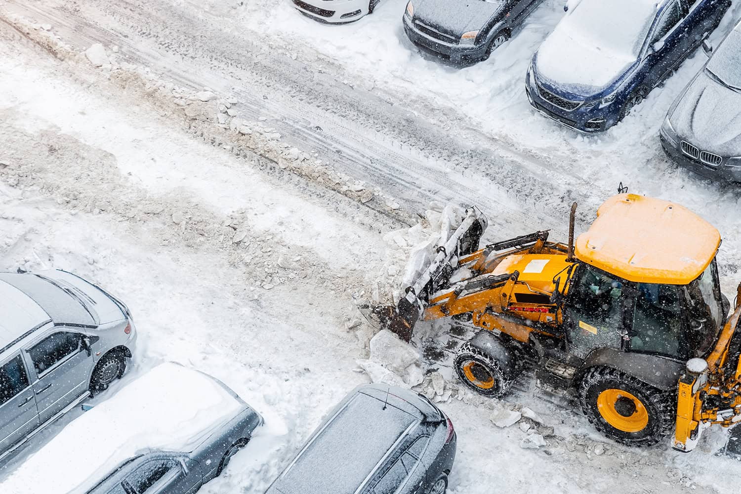 Tractor,Loader,Machine,Uploading,Dirty,Snow,Into,Dump,Truck.,Cleaning